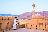 Abdullah, guide of the Museum, posing at Nizwa Fort, Ad Dakhiliyah Region, Sultanate of Oman, Arabian Peninsula, Middle East