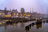  Typical canal in the misty dusk, Harlingen, Friesland, Netherlands  