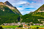 Beautiful Cityscape and Castle Craap da Sass and Alpine Lake Silvaplana with Mountain View in the Swiss Alps in a Sunny Summer Day in Silvaplana, Maloja, Grisons, Switzerland.