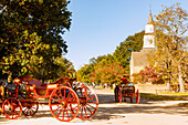  Carriages on Duke of Gloucester Street and Bruton Parish Church in the Living History Museum Colonial Willliamsburg in Williamsburg in the American Historic Triangle, James City County, Virginia, USA 
