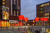  Illuminated sculptures Dortmund Roses in front of the Dortmund landmark U, Center for Art and Creativity at dusk, Dortmund, North Rhine-Westphalia, Germany, Europe 
