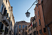 Steet and building facades and lamp in Venice, Italy