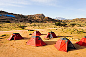 Camp inside the Painting Rocks site, work of the Belgian artist Jean Verame. around Tafraout,Anti-Atlas,Morocco,North Africa