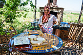 Tasting of goat, sheep and cow cheeses in the garden of a farm near the Dayet Aoua lake, Morocco, North Africa