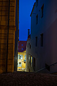 Narrow Staircase in Old Town with Illuminated House and Window in Dusk in City of Neuchatel, Canton Neuchatel, Switzerland.