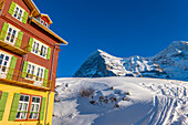 The Famous and Historical Hotel Bellevue des Alpes at 2061 Meters High Up and Mountain Peak of North Face of Eiger 3907 Meter High in a Sunny Winter Day in Kleine Scheidegg, Grindelwald, Canton Bern, Switzerland.