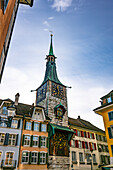 The Zeitglockenturm Clock Tower and Colorful House Facades on the Market Square in the Heart of the Baroque Old Town with Sunlight in a Sunny Autumn Day in Solothurn, Canton Solothurn, Switzerland.