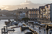  The northern promenade along the Douro River in Porto in golden light after a rain shower, Portugal 