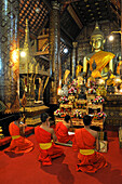 Novice monks at Buddhist temple Wat Xieng Thong, Luang Prabang, Laos, Southeast Asia