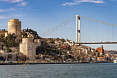  The Rumeli Hisarı Fortress and the Fatih Sultan Mehmet Bridge over the Bosphorus in Istanbul, Türkiye  