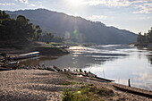  Canoes and excursion boats along the banks of the upper Mekong, Bhan Khok Aek, Hongsa, Sainyabuli, Laos, Asia 