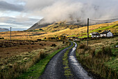  Lonely country road in the west of Ireland near Lough Inagh, County Galway, Ireland 