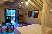 Room in a bungalow of Eco-lodge Hara Oasis on the banks of the River Draa in the large palm grove in Agdz at the foot of Djebel Kissane, Mount Kissane (Jbel Kissane), Draa-Tafilet region, Morocco, North West Africa