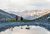 Trekkers on the way down from Stokla pass (4900) to the village of Stok, Hemis National Park,Ladakh region, state of Jammu and Kashmir,India,Asia