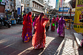 Women dressed in sari in a street near Meenakshi Amman Temple, Madurai, Tamil Nadu state, South India, Asia
