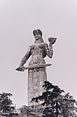 Mother Georgia statue holding wine cup and sword