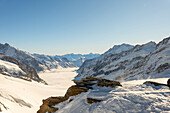 Beautiful Aletsch Glacier in a Sunny Winter Day with Snowcapped Mountain with Sunlight in Jungfraujoch in Berner Oberland, Grindelwald, Canton Bern, Canton Valais, Switzerland.