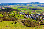  Beginning of flowering and fresh cherry blossoms on the Walberla (Zeugenberg, Ehrenbürg), view from the Walberla summit to Schlaifhausen in Franconian Switzerland, Franconia, Bavaria, Germany 