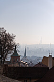 View of the Old Prague areas from the top in misty morning
