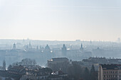 View of the Old Prague areas from the top in misty morning