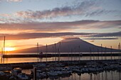 Portugal, Azores, Pico Island,  Ponta do Pico volcano, seen from Horta harbor, sunrise, 