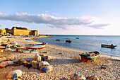  Beach with fishing boats in front of the Kasbah and Medina in Hammamet, Tunisia 