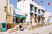  Rue Okba Ibn Nefaa (Av. Oqba Ibn Nafaa) with handicraft shops in the medina in Kairouan, Tunisia 