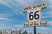 Sign marking end of iconic Route 66 highway at Santa Monica Pier, Los Angeles, California, USA