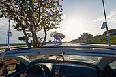 A Mercedes CLK convertible with top down drives by Manhattan Beach, Los Angeles, USA