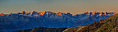  Panorama of the Bregaglia Mountains in alpenglow with Piz Badile and Piz Cengalo, from Passo San Marco, Orobie Alps, Lombardy, Italy 
