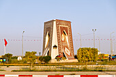  Traditional Tunisian carpet as monumental spinning top art and landmark in the circular island at the entrance to Kairouan, Tunisia 