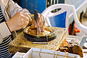  Craftsmen working on brass plates in the Medina of Tunis, Tunisia 