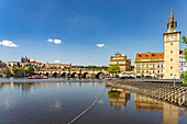  Cityscape of Prague with Vltava River, Old Town Water Tower, Novotný Bridge, Castle and Charles Bridge in Prague, Czech Republic 