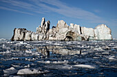  This photo was taken on a windless day and shows icebergs and ice reflected in the smooth waters of Vikingebugt, East Greenland, Greenland Europe 