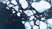  Aerial/drone image of sea ice and Zodiacs with passengers of an expedition cruise ship, Svalbard, Norwegian Arctic (ice edge approx. 80° N), Europe 