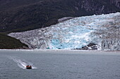  Zodiac inflatable boat from the expedition cruise ship Ventus Australis (Australis Cruises) in front of the Pio X Glacier, Eyre Inlet, Chilean Fjords, Magallanes and Chilean Antarctica, Patagonia, Chile, South America 
