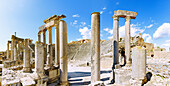  Theater with columns of the stage and tiers, ruins of ancient Thugga at the archaeological site near Dougga, Tunisia 