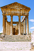  Capitol with temple in honor of Jupiter, Juno and Minerva, ruins of ancient Thugga at the archaeological site near Dougga, Tunisia 