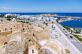  Fortified monastery of Ribat and view from the round tower of the Port de Plaisance with marina and the sea, in the old town (Medina) of Monastir, Tunisia 