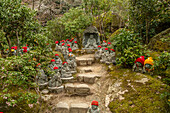 Path to the Daisho-in Temple, adorned with 500 Rakan Statues in knitted hats, Miyajima Island, Hiroshima Prefecture, Japan.