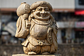 Relaxing Daikoku, one of the seven Gods of fortune, in Takayama, Gifu, Japan.