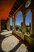  View through the arcades of the terrace of Villa Hanbury to the pavilion, the garden and the sea, Hanbury Botanical Garden, Ventimiglia, Liguria, Italy 