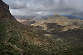  Rainbow over scenic view in the highlands of the Roque Nublo Reserve, Gran Canaria, Canary Islands, Spain, Europe 