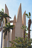 View of palm trees and Russian Egyptian friendship monument at High Dam Aswan, Egypt