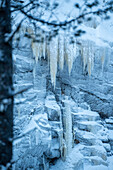 Ice climbing, frozen waterfall in Korouama, Finland, Arctic Circle