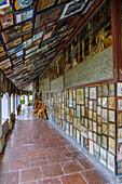  Open gallery of the Chapel of Grace with votive images and wooden crosses in Altötting, Upper Bavaria, Bavaria, Germany 