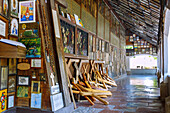  Open gallery of the Chapel of Grace with votive images and wooden crosses in Altötting, Upper Bavaria, Bavaria, Germany 