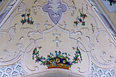  Stucco detail with a colorful fruit basket and leaf garlands in the interior of the pilgrimage church of the Innocents in the church village of Heiligenstatt in Markt Tüßling, Upper Bavaria, Bavaria, Germany 