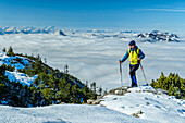  Man hiking to Wallberg, view of Wetterstein with fog in the valley, Wallberg, Bavarian Alps, Upper Bavaria, Bavaria, Germany 