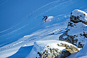  Man on ski tour skiing through powder snow, Felskarspitze, Niedere Tauern, Salzburg, Austria 